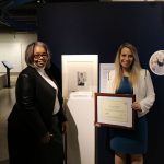 Genna Callahan with her Teacher Award in front of Sadako's Crane