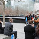 Volunteer Dan leading teachers and students on a walking tour of the 9/11 Memorial